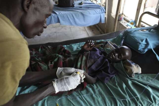 Health worker attending to a malaria patient illustrative photo