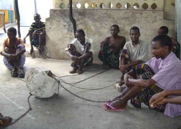 In this photo, chained mentally ill patients sit within Ahlu Khayr mental health centre in Mogaidshu, Somalia. Somalia may be the worst place on earth to have a mental illness. A 20-year civil war has increased mental illness numbers and simultaneously destroyed any health care infrastructure.File: AP.